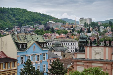 Photo for High panoramic view of Decin (Tetschen), Czech city in Usti nad Labem Region. Old villas, baroque buildings, churches and communist-built panel block of flats. Protected mountain area. Tourist destination. - Royalty Free Image