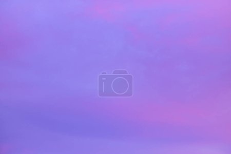 Photo for Blue pink violet lilac white smooth wavy clouds at calming sunset or sunrise. Sky with heaven morning or evening cloud pattern background. Moody lovely atmosphere. - Royalty Free Image
