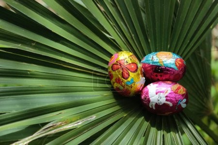 Photo for Palm Sunday dinner. Colored and chocolate easter eggs. Catholic religious holiday. Wallpapers and bachground. - Royalty Free Image
