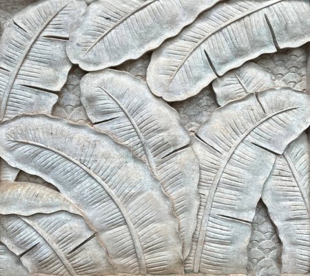 Low-relief leaf craft in cement style.
