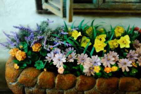 Close-up of the little artificial flowers. Artificial flower scene for decoration, art craft or display. Flower and plant.