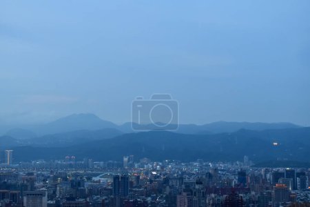 Aerial view of skyline of Taipei city at sunset from Xiangshan Elephant Mountain with colorful sky. Beautiful landscape and cityscape of Taipei downtown buildings and architecture in the city
