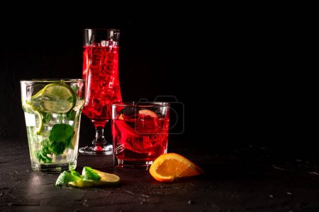 Summer drink on black background. Negroni, Mojito and Aperol. Classic refreshing drink on black background. 