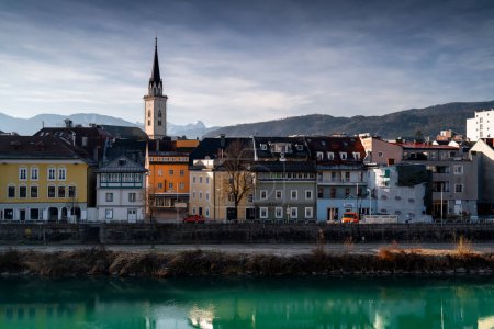 Villach, Austria. View on chrch and background high mountains.