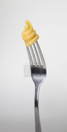 Foto de Fork with pasta isolated on white background - Imagen libre de derechos