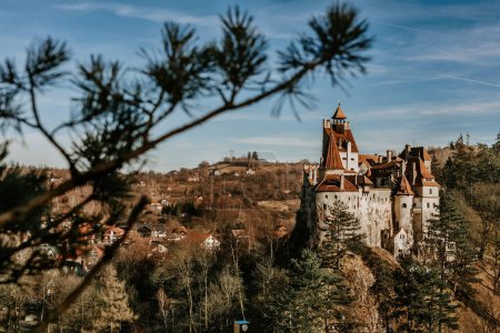 Photo for Bran castle or Count Dracula Castle on top of rocky hill in Transylvania. Medieval fortress in Romania, popular travel destination and touristic landmark. Gothic vampire castle in haunted forest. - Royalty Free Image