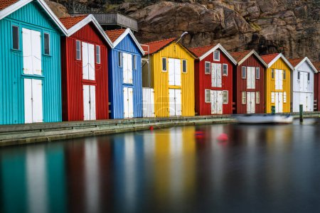 Photo for Sweden houses, small colorful fishermen's houses in Sweden smog. A great city right by the sea with a rock in the background - Royalty Free Image