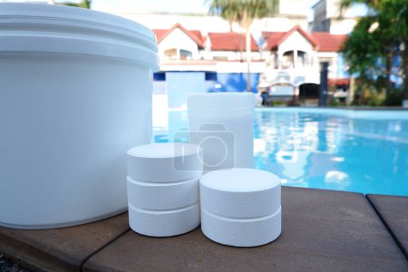 Photo for White chlorine for swimming pool disinfection, pool water maintenance. - Royalty Free Image