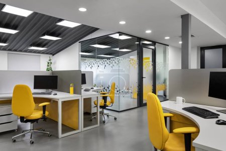 It office with workplaces for employees . High quality photo. Computer for coding software.