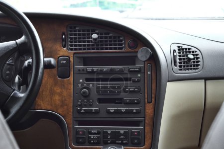 The car's beautiful interior is black and brown in color