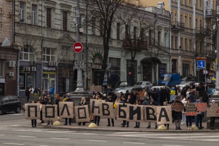 Kyiv, Ukraine - February 4, 2024. Relatives and friends with placards gathered in the center on Khreshchatyk to honor the fighters of "Azovstal", who have been in Russian captivity for almost two years. everyone is waiting for their return magic mug #700672342