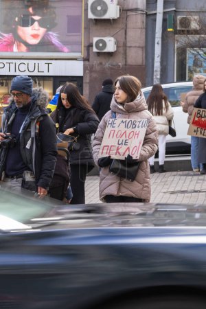Photo for Kyiv, Ukraine  February 4, 2024. People with posters gathered again in the center to remind about the fighters of "Azovstal", who have been in Russian captivity for almost two years. relatives are waiting for their arrival - Royalty Free Image