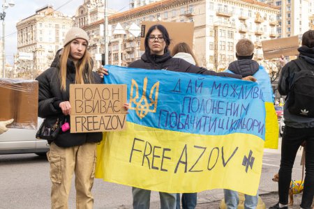Photo for Kyiv, Ukraine  February 4, 2024. People with posters gathered again in the center to remind about the fighters of "Azovstal", who have been in Russian captivity for almost two years. relatives are waiting for their arrival - Royalty Free Image
