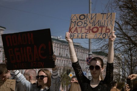 Photo for Kyiv, Ukraine. On April 7, 2024, many caring people came out in the city center to remind everyone that the Azov military has been in russian captivity for two years. People are leaving in their cars and honking loudly with placards. - Royalty Free Image