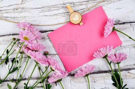Photo for Mother's day card for greetings with pink flowers on wooden vintage background. Mock up for wishes. - Royalty Free Image