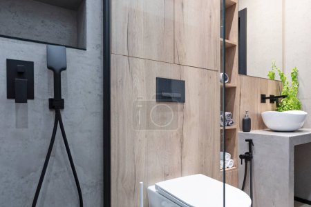 Téléchargez les photos : Modern bathroom with bathtub with glass, toilet and stylish wash basin on the counter. Luxury and elegant interior in new apartment. - en image libre de droit
