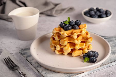 Photo for Food photography of waffles with blueberries, breakfast, milk, belgian, snack, dessert, sweet food - Royalty Free Image