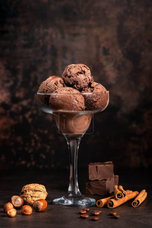 Photo for Food photography of chocolate ice cream, hazelnut, walnut, cinnamon, coffee, frozen, cool; scoop, glass - Royalty Free Image