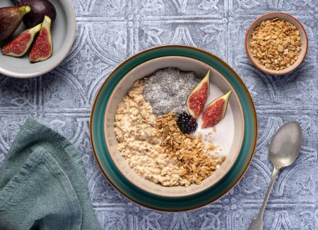 Photo for Food photography of oatmeal, chia seeds,  granola, muesli, oat, yogurt, fig, blackberry - Royalty Free Image