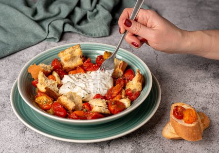 Photo for Food photography of baked tomatoes, soft, cheese, burrata, mozzarella, garlic, crouton, thyme, toast - Royalty Free Image