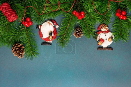 Photo for Background photo of branches, pine cones, ornaments, Christmas decorations, toy snowman, toy Santa, Christmas, new year, vintage, retro, copy space, blank, postcard - Royalty Free Image
