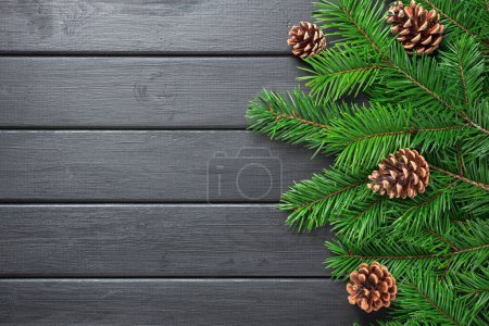 Photo for Background photography of fir branches,  pinecones, black wooden table, Christmas, winter, copy space, blank, card - Royalty Free Image