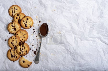 Photo for Food photography of cookie, melted chocolat, spoon - Royalty Free Image
