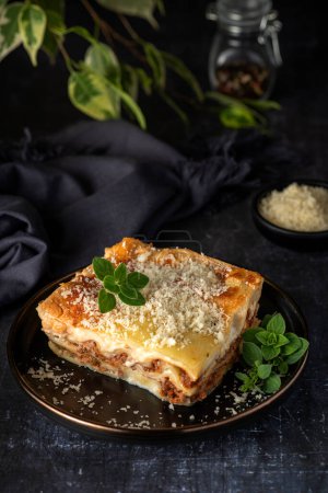 Photo for Food photography of lasagna, cheese, parmesan, oregano - Royalty Free Image
