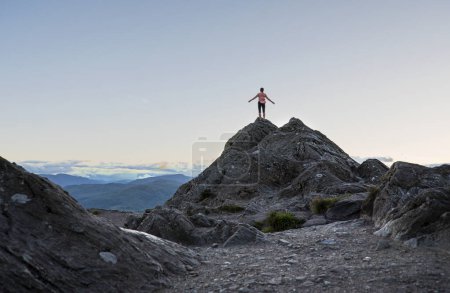 Photo for Landscape photography of  mountains, peak, woman, sunset - Royalty Free Image