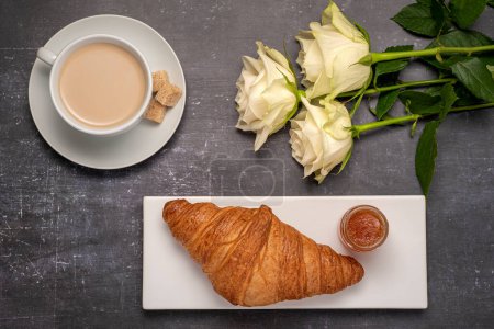 Photo for Food photography of breakfast, croissant, cappuccino, jam, rose - Royalty Free Image