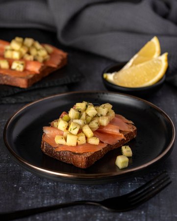 Photo for Food photography of sandwich with smoked salmon, toast, cucumber, lemon - Royalty Free Image