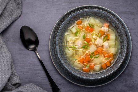 Photo for Food photography of soup, broth, noodle, potato, chicken, carrot - Royalty Free Image
