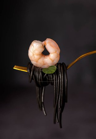 Photo for Macro food photography of  black spaghetti, pasta, shrimp, prawn - Royalty Free Image
