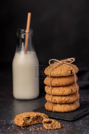 Photo for Food photography of oatmeal cookies, biscuits, milk, bottle - Royalty Free Image