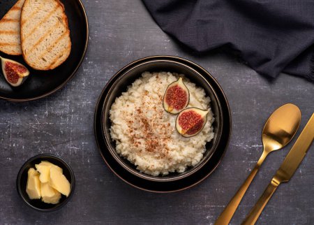 Photo for Food photography of rice porridge, pudding, cereals, figs, cinnamon, butter, toast - Royalty Free Image