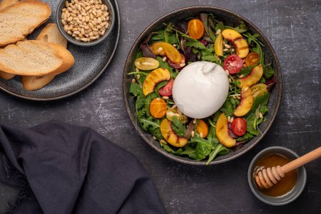 Photo for Food photography of salad with burrata, tomato, leaves, grilled peach - Royalty Free Image