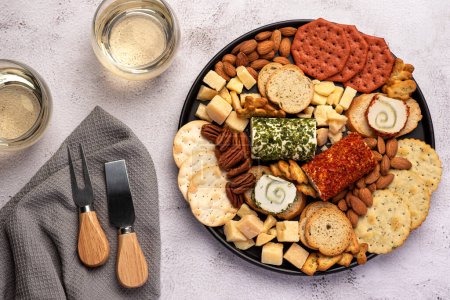 Photo for Food photography of antipasti, cheese, cheddar, parmesan, toast, cracker, almond, pecan, wine - Royalty Free Image