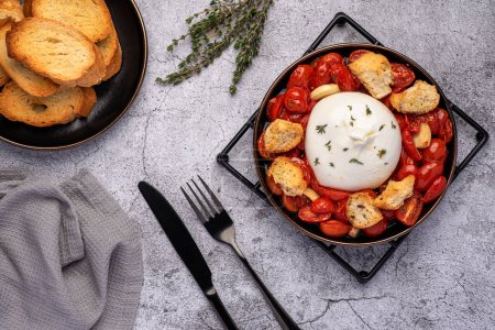 Photo for Food photography of baked tomato; cheese; burrata; garlic; thyme; toast - Royalty Free Image