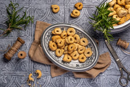 Photo for Food photography of taralli with rosemary, salty, bread, crunchy, crispy, rustic, homemade, baked, italian, cracker - Royalty Free Image