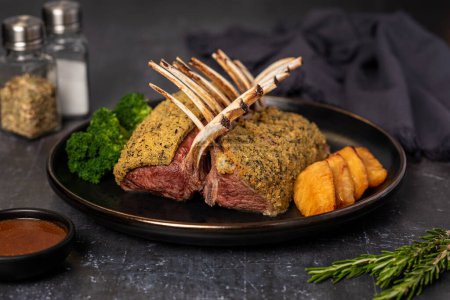 Photo for Food photography of roasted lamb, meat, butchery, breaded, garnish - Royalty Free Image