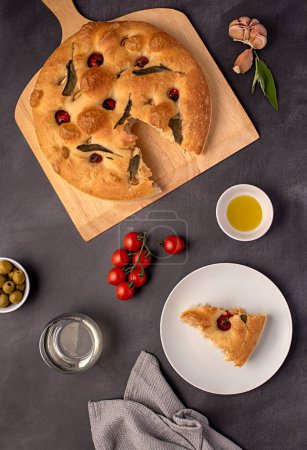 Photo for Food photography of sourdough focaccia, white wine, tomato, olive oil, garlic, sage, bakery, picnic, appetizer - Royalty Free Image