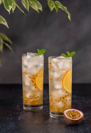 Photo for Food photography of passion fruit drink, mocktail, soda, orange, ice, mint, freshness, summer; exotic; citrus - Royalty Free Image