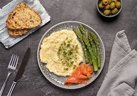 Photo for Food photography of breakfast, scrambled egg,  brunch, omelet, smoked salmon, asparagus, olive, toast - Royalty Free Image
