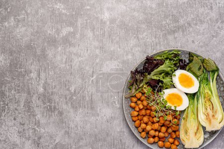 Photo for Blank food photography of breakfast, boiled egg, fried crispy chickpeas, bok choi, leaf, lettuce, cress salad, brunch - Royalty Free Image