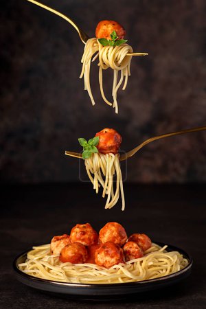 Photo for Food photography of meatball, chicken, beef; meat, spaghetti, pasta, tomato, sauce, basil, veal, fried, grilled, roasted, fork - Royalty Free Image