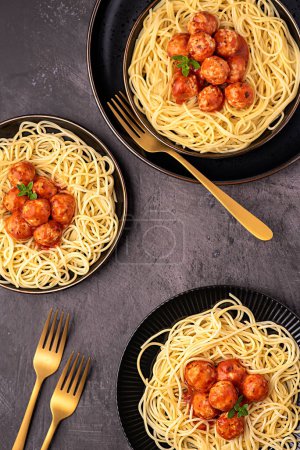 Photo for Food photography of meatball, chicken, beef; meat, spaghetti, pasta, tomato, sauce, oregano, fried, grilled, roasted, fork - Royalty Free Image