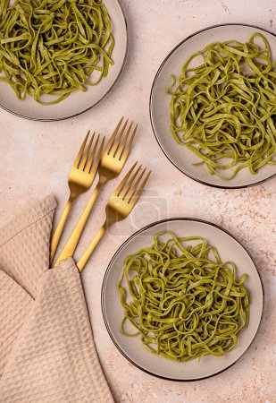 Photo for Food photography of pasta, linguine, fettuccine, trenette, spinach, durum, wheat, semolina, fork, background, italian - Royalty Free Image