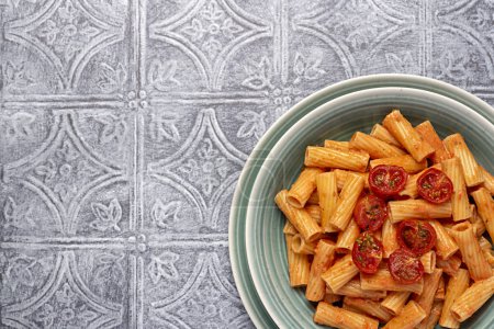 Photo for Blank food photography of pasta, rigatoni with  roasted tomatoes, sauce, olive oil, durum, wheat, semolina, background, italian - Royalty Free Image