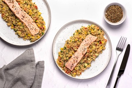 Photo for Food photography of baked, salmon, dish, salad, quinoa, cucumber, pepper, tomato, seasoning, fresh, chives, meal, food - Royalty Free Image