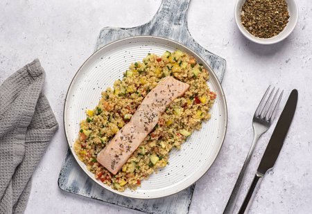 Photo for Food photography of baked salmon, dish, salad, quinoa, cucumber, pepper, tomato, seasoning, fresh, chives, meal, food - Royalty Free Image